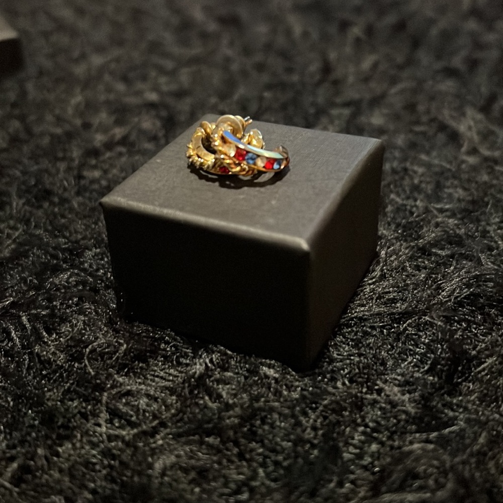 Gold earrings with red, white & blue stones. 1/2 inch circumference.